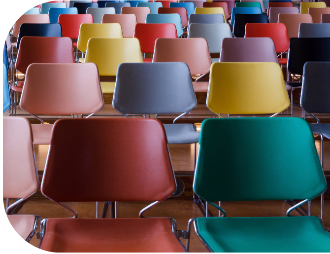 Colourful chairs in a lecture theatre