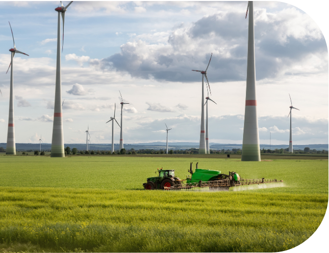 Tractor under wind turbine on multifunctional land