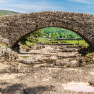 Stone bridge going over a dried up riverbed