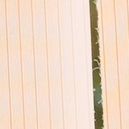 Blinds swaying in front of an open window.