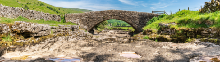 Stone bridge going over a dried up riverbed