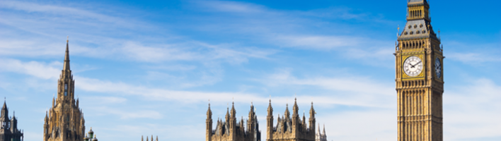 UK Parliament with a bus passing over the River Thames