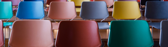 Rows of empty colourful chairs