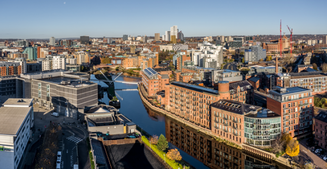 Leeds skyline overlooking the docks with a range of civic, residential, and industrial buildings
