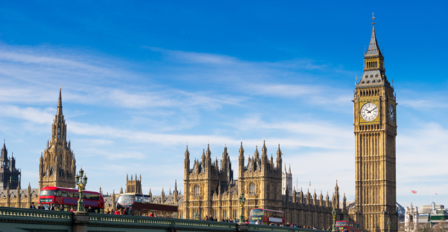 UK Parliament with a bus passing over the River Thames