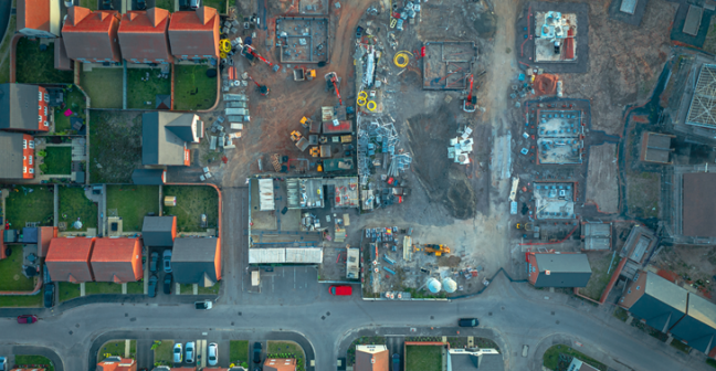 Construction site next to houses