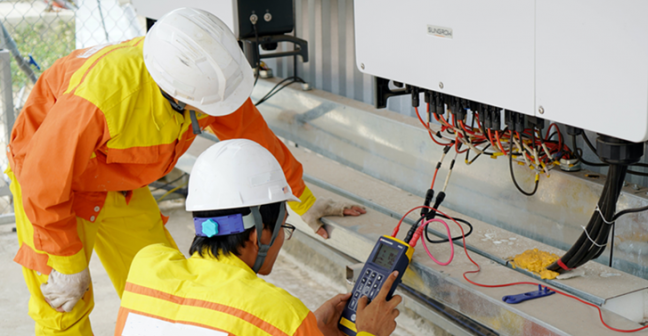 two people conducting a solar panel assessment