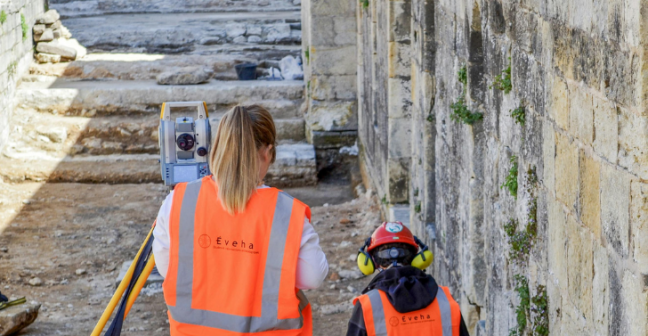 Photograph of two heritage professionals on site