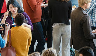 A group of people talking during a conference break