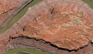 meandering river through a dusty land
