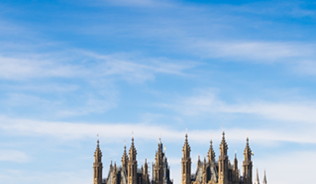 UK Parliament with a bus passing over the River Thames