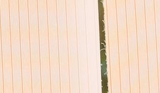 Blinds swaying in front of an open window.