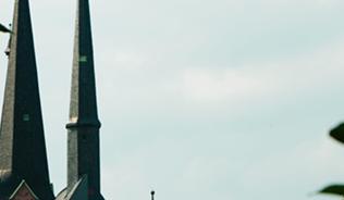 church spire with trees