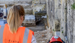 Photograph of two heritage professionals on site