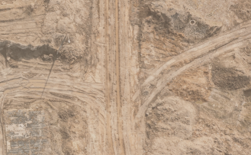 Bare soil with machinery tyre marks