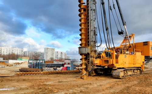 Pile driving machine on a construction site
