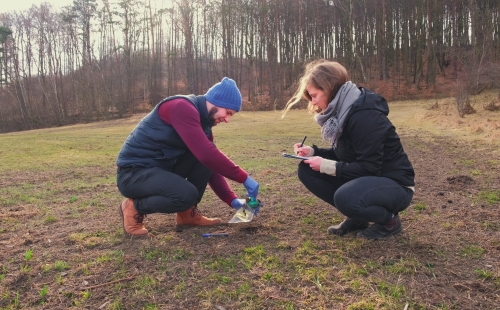 Environmental scientists collecting soil samples out in the field