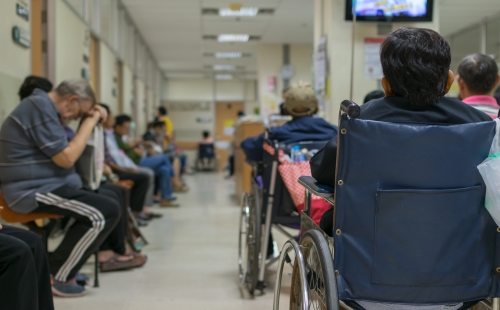 Patients wait in a UK NHS hospital waiting room