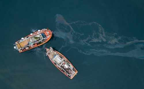 Fishing boats and oil spill