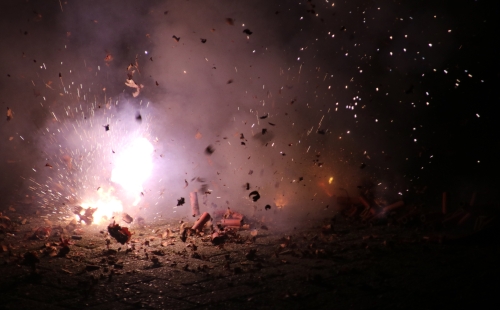 Fireworks exploding on pavement