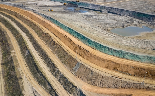 Aerial view of industrial terraces on mineral open pit mine