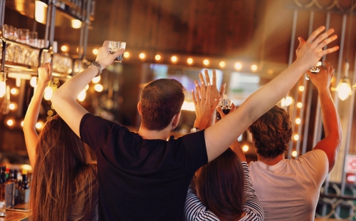 Watching sports at a pub with friends