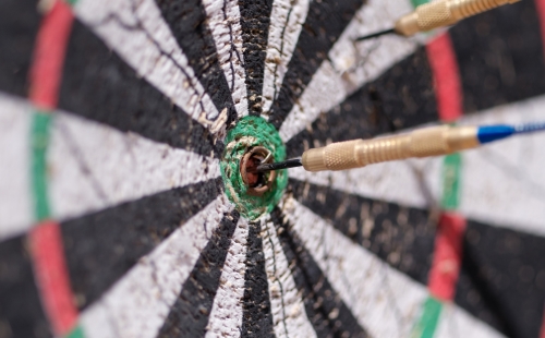 Darts hitting a target