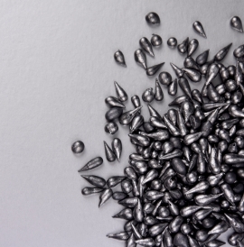 Scattered drops of lead on a plain background