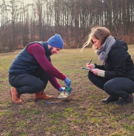 Environmental scientists collecting soil samples out in the field