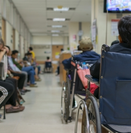 Patients wait in a UK NHS hospital waiting room