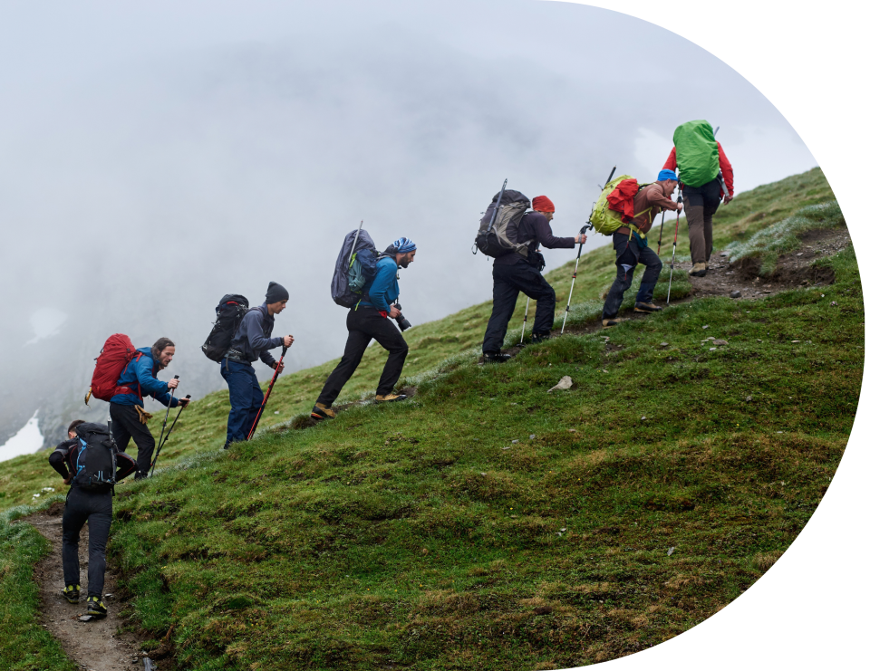 A group of walkers going up a fell
