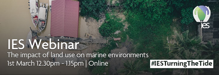 View from above of a coastal area with small boats and a pier nearby green tropical plants and houses. Superimposed with text reading "IES Webinar. The impact of land use on marine environments. 1st March 12:30pm - 1:15pm. Online. #IESTurningTheTide"