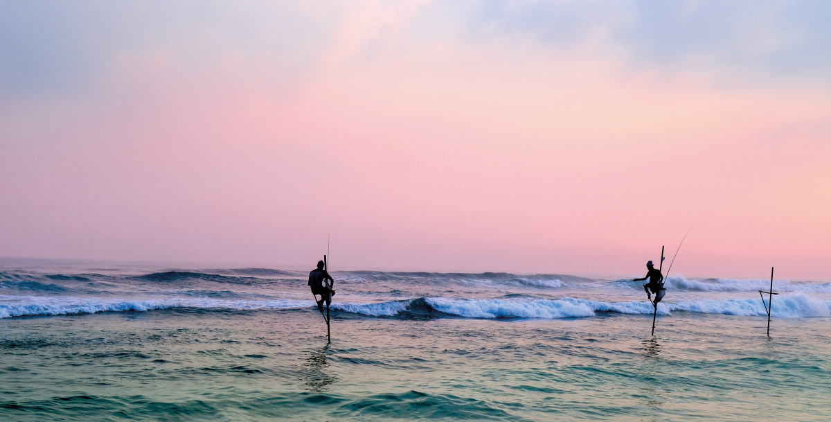 Photograph of Silhouettes of the traditional stilt fisherman at sunset © alinamd